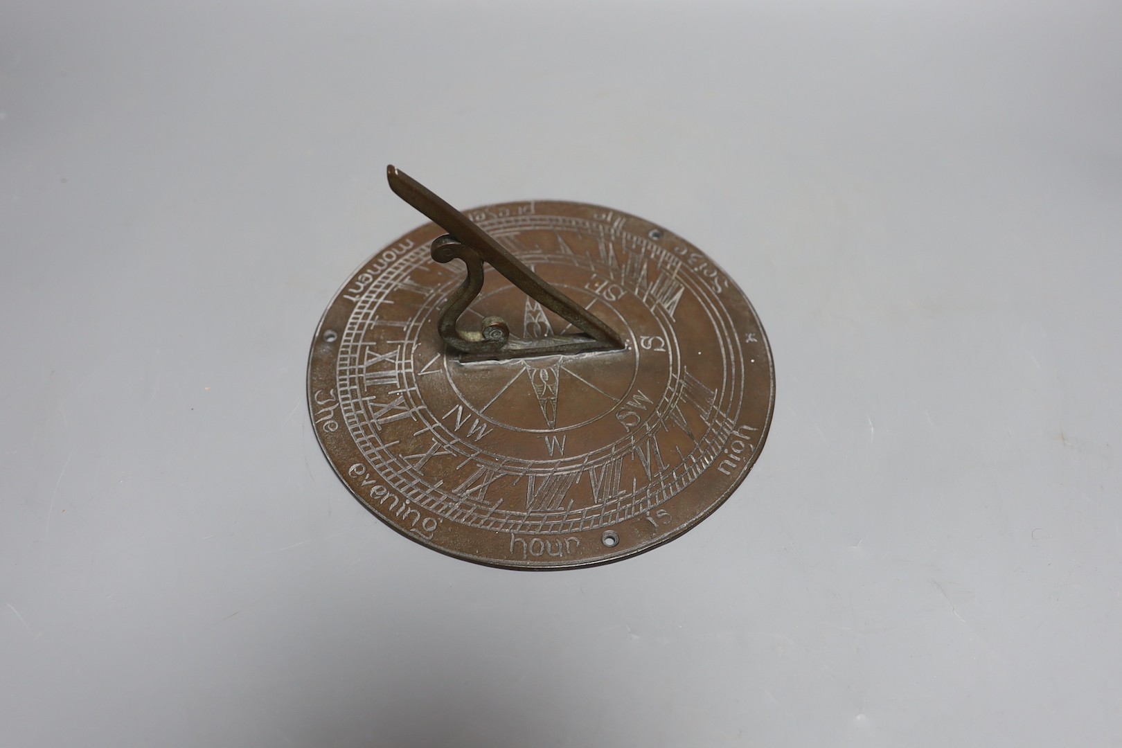 A cast brass sundial 19.5cm diameter